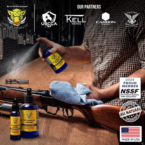 Man cleaning rifle with Premium Gun Cleaner And Lubricant CLP Spray For Metal Surfaces; bottles in foreground by Boar Products