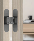 Hidden Door Hinge Set Gunmetal Grey 180 Degree Adjustable Concealed and Invisible Hinge 2PCS installed on light wood door
