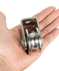 Cable Pulley Wheel Heavy Duty, Fixed Pulley Block, Bearing Inside, held in a hand to show size and design.