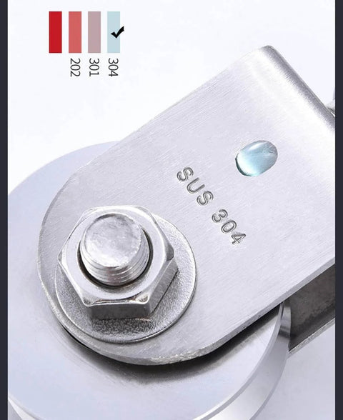 Close-up of a stainless steel pulley wheel marked SUS 304, showing dual bearings and part of the wheel mechanism.