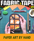 Person crafting Halloween-themed paper art with sticky double sided fabric tape for clothes and leather quick hemming and alterations.