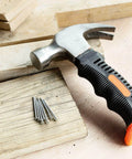 600 Piece Nail Assortment Kit Silver Nails In 4 Sizes For Hanging Pictures And Finishing Nails with hammer on wood