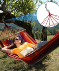 Person reclining in a hammock attached to a tree using 4 Pack Double Ended Snaps 3.5 Inch Zinc Alloy Trigger Metal Clips Silver Double Ended Snap Hooks For Dog Leash Water Buckets Key Holder Carabiner And More For Home Farm Outdoor Use, with a close-up inset of the snap hook.