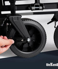 Person using Bolt Size Finder Keychain Gauge on caster wheel, showing tool in use for precise size identification.