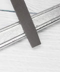 Flat Hand File With Double Cut Teeth For Wood And Metal In High Carbon Steel, showing textured teeth on flat metal.