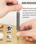 Hands holding Two-Piece Dual Head Nail Setter, demonstrating use on wood surface; compact hammerless design visible