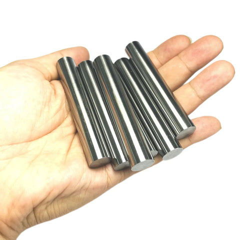 Six Pack One Half Inch Diameter And Three Inch Length Dowel Pins For Solid Wood Projects held in hand