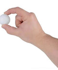 Hand holding a Rhode Island Novelty 1.5 Inch Plastic Ping Pong Ball, Pack of 12, showing size and material.