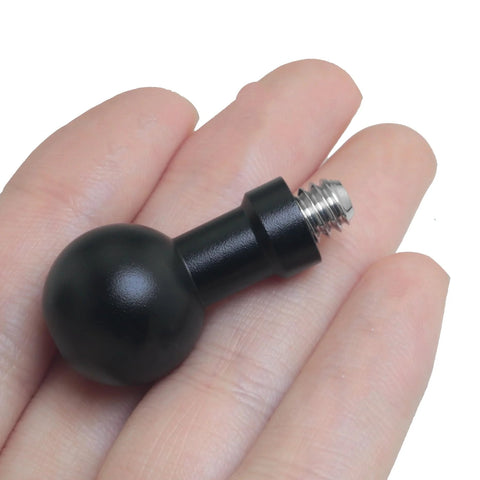 Close-up of a Two Pack 17mm Ball Head to Quarter Inch Stainless Steel Short Screw Connecting Rod held in hand, showing black aluminum and steel construction.