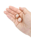 1 inch Solid Copper Baoding Balls with Carry Pouch for Hand Therapy, Exercise, and Stress Relief shown in hand for size comparison