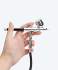Three Meter Airbrush Hose BD-30 With Quick Disconnect And Standard One Eighth Fittings connected to airbrush in hand