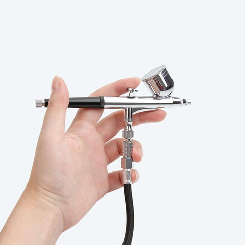 Three Meter Airbrush Hose BD-30 With Quick Disconnect And Standard One Eighth Fittings connected to airbrush in hand