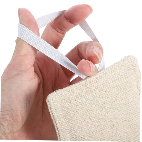 Experience quiet, safe doors with these tool-free door silencers made of beige fabric held by a hand with an elastic loop.