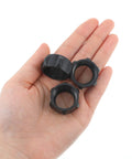 Hand holding six pack replacement tightening nuts for 17mm ball head car mounts screw on adapters M17 by one point five thread