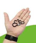 Person holding black vinyl coated cup hooks from the Vinyl Coated Cup Hook Kit With Screws And Plugs, 46 Pcs, Six Sizes.