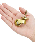Person holding a Universal Brass Caster Wheels 21mm 360 Degree Swivel Stem Casters Set Of 4 With 12 Screws Heavy Duty Furniture Replacement