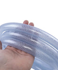 Hand holding High Pressure Braided Clear Flexible PVC Tubing Three Quarter Inch Internal Diameter Ten Feet Long With 200 PSI Working Pressure
