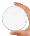 Person holding a round clear Six Pack Adhesive Door Stopper Wall Protectors Clear Gel Bumpers That Quietly Shield Walls From Door Slams