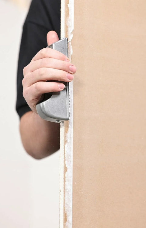 Person using Pocket Drywall And Ceiling Tile Rasp With Replaceable Blade Designed For Fine Edge Trimming Of Drywall And Tiles Compact Tool