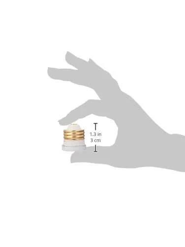 Person holding TL 20 Time Delay Plug Fuse 20 Amp Edison Base 125V UL Listed Fusetron showing size and dimensions, DIY friendly.