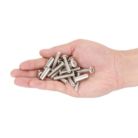 Hand holding various metal pieces from 100 Piece M6x30mm Hexagon Nuts And Bolts Assortment Kit With Cap Nuts And Socket Covers For Machine Screws.