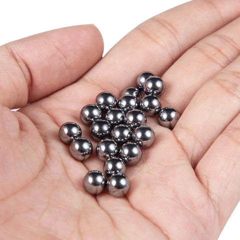 Close-up of small stainless steel balls in hand, related to the ✝️ 620-Pack Utility Cart 8 mm Platform Size Stainless Steel Frame.