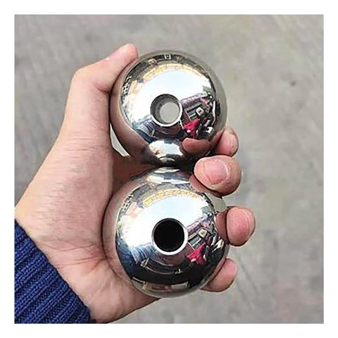 Hand holding two polished 304 stainless steel through-hole balls, part of 10pcs Through Hole Steel Balls 304 Stainless Steel Solid Piercing Balls Dia 3-12.7mm DIY Beading Round Ball(9mm x Hole Dia 3mm) set.