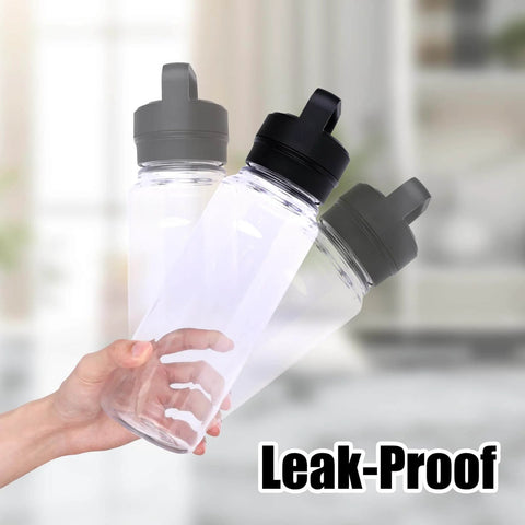 Person holding three Yonder water bottles with leak-proof lids, shown in clear plastic with dark-colored caps in focus.