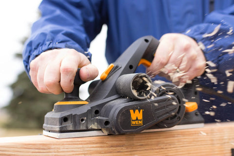 Person using Efficient 3-1/4 inch hand planer with a 6 Amp motor delivers fast, precise planing for doors, trim, and cabinetry on wood