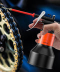 350ml Hand Pump Oiler Can With Straight Spout High Pressure Lubrication Dispenser in use on motorcycle chain