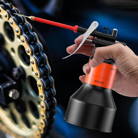 350ml Hand Pump Oiler Can With Straight Spout High Pressure Lubrication Dispenser in use on motorcycle chain