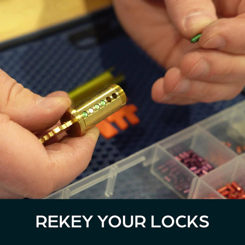 Person using Ultimate Rekey Kit For Schlage Locks With 50 Master Pins And Seal Tight Box for rekeying locks