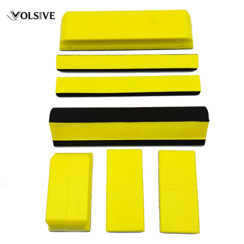 7 Piece Hand Sanding Block Set With Interchangeable Pads for auto body polishing, featuring yellow blocks in multiple sizes.