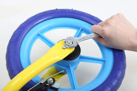 Using the 121 Piece Mechanic Tool Set With One Quarter And Three Eighth Inch Drive Sockets, Metric And Standard Wrenches, Bits, Hex Keys And More For Car, Home And Auto Repair on a blue bicycle wheel.