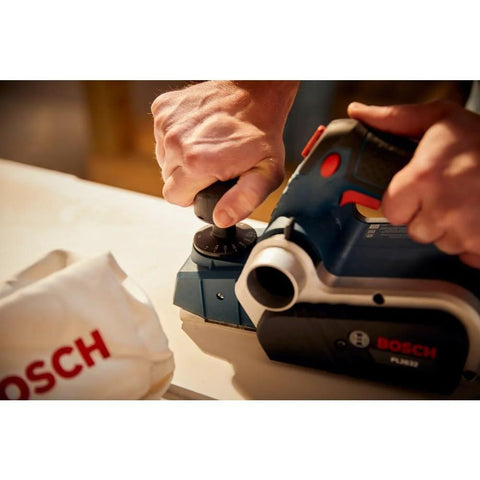 Efficient Three And A Quarter Inch Planer Kit Delivers Precise Stock Removal With A Powerful Six Point Five Amp Motor And Sixteen Thousand Five Hundred RPM Featuring A Dual Mount Guide Fence And Woodrazor Blades To Create Smooth Straight Edges On Doors being used on wood surface.