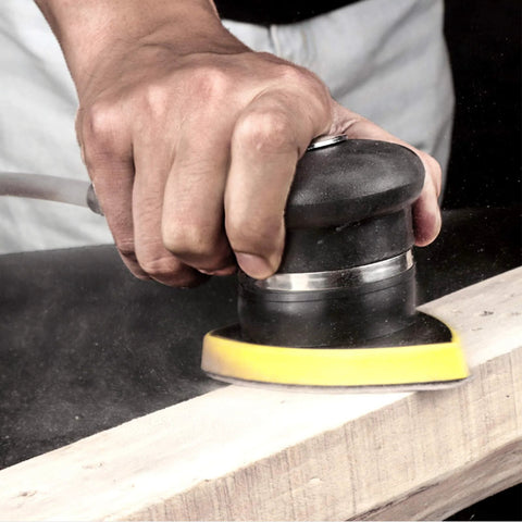 Person using 120 Grit Mouse Detail Sander Sandpaper 50 Pcs 5 Hole Hook And Loop 140mm Sheets on wood surface.