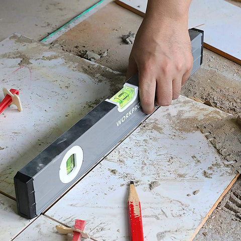 Pro Grade 3 Piece Torpedo Level Set With Magnetic 9 Inch Level And Non Magnetic 16 Inch And 24 Inch Levels, in use on tiles