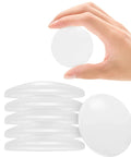 Hand holding Six Pack Clear Silicone Door Stoppers for Walls Self Adhesive Door Bumpers to Stop Slams Round Wall Protectors 1.57 by 1.57 by 0.31 Inches.