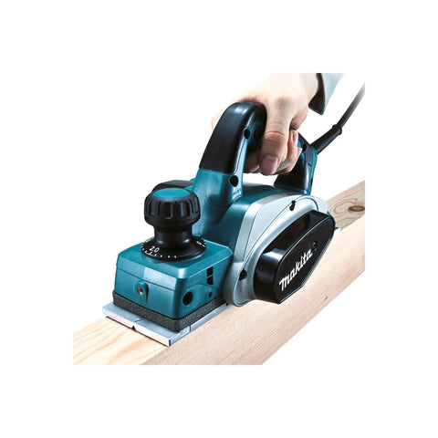 Three And A Quarter Inch Planer With Tool Case Six Point Five Amp Motor Delivers Fast Smooth Stock Removal For Professional Carpentry Woodworking And Framing Projects Including Window And Door Installations And Fine Finishing being used on wood surface.