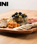 Handmade Premium Fir Wood Lazy Susan Turntable Organizer with Rustic Serving Platter and Cheese Board set with snacks on table.