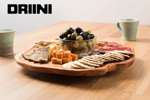 Handmade Premium Fir Wood Lazy Susan Turntable Organizer with Rustic Serving Platter and Cheese Board set with snacks on table.