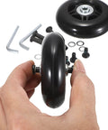 Hand holding 75mm x 23mm Luggage Wheels Replacements Set of 2 Mute Suitcase Replacement Wheels with Black Screws Axles Bearings in the background