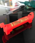 Side view of Seven Piece Hanging Bubble Line Level Set For Building Trades And Surveying Durable ABS Plastic Three Inch Length
