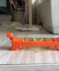 Side view of a Seven Piece Hanging Bubble Line Level Set For Building Trades And Surveying Durable ABS Plastic Three Inch Length.