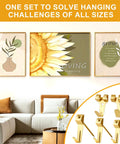 Living room wall with framed art and 303 Piece Picture Hanging Kit With Heavy Duty Hooks Nails Sawtooth Wire D Rings And Level In A Categorized Organizer.
