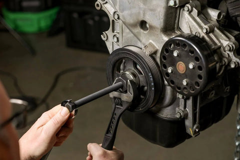 Master Harmonic Balancer Install Kit For Domestic And Import Vehicles With Extra Long Installers in use on engine