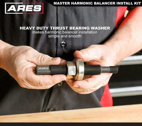 Person holding Master Harmonic Balancer Install Kit for domestic and import vehicles with extra long installers.