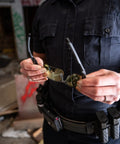 Person holding Harrier Interchangeable Shooting Glasses With 4 Lens Sets And Anti Fog Lenses in urban setting