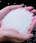 Hands holding HDPE white plastic welding rod pellets, material for DIY car bumper repair, water tanks, canoes, and plastic bins patch jobs.