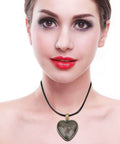 Woman wearing heart pendant from DIY Necklace Making Kit with Base Tray Pendant Molds and 60pc Metal and Plastic Accessories for Crafting